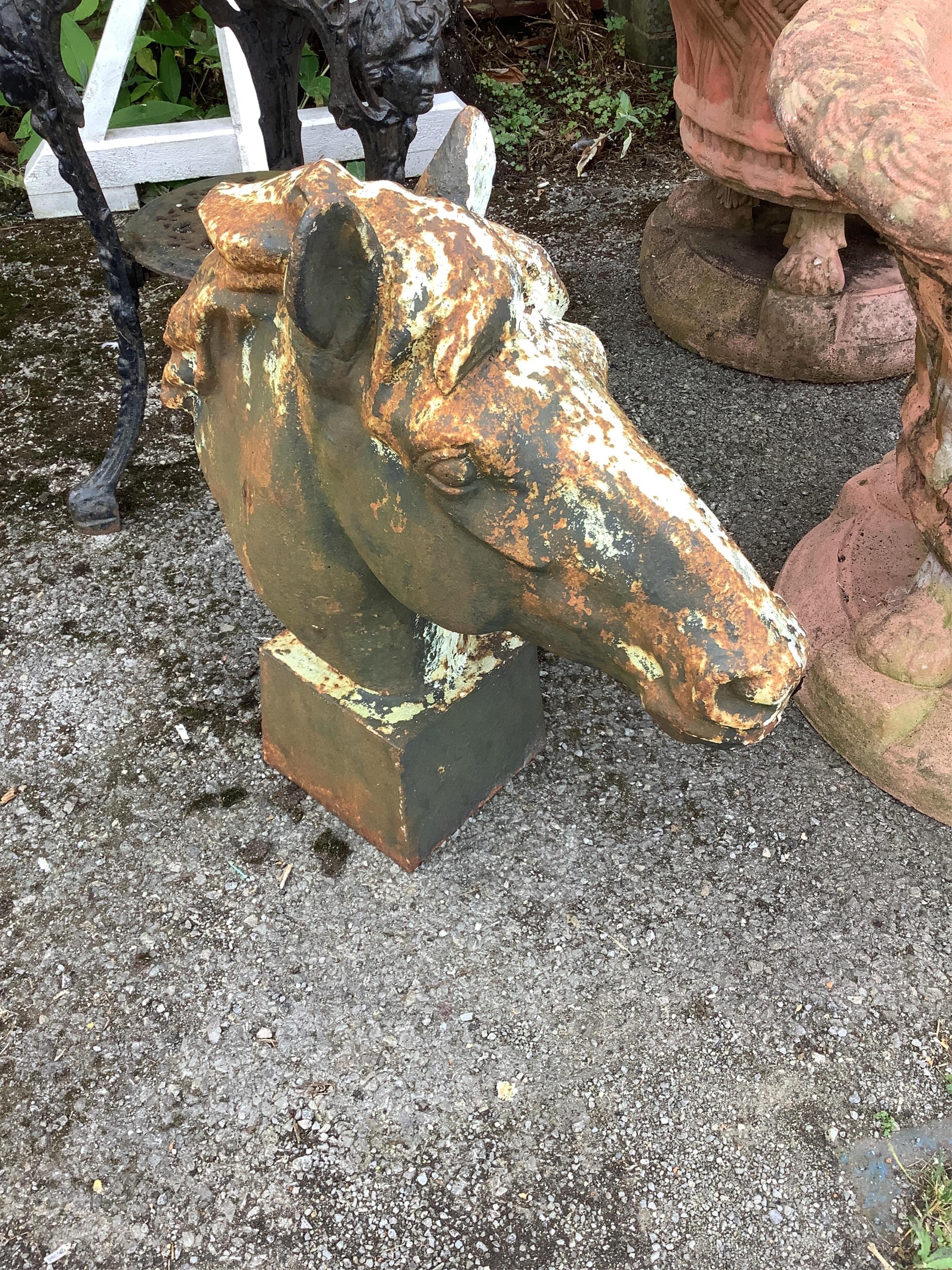 A cast iron horse head finial garden ornament, height 60cm. Condition - fair